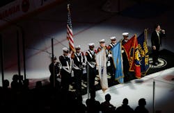 The Boston Fire Department honor guard presents the colors at the Bruins-Sabres game.