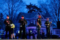 Police officers guard the entrance to Franklin street where the search for the suspect in the Boston Marathon bombings in Watertown, Mass. Police officers guard the entrance to Franklin street where the search for the suspect in the Boston Marathon bombings in Watertown, Mass.