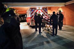 Responders salute as the body of their captain is removed from an ambulance at the hospital. Responders salute as the body of their captain is removed from an ambulance at the hospital.