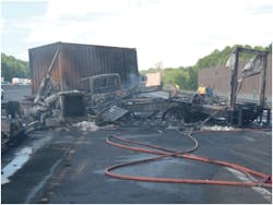Photo 10 - The trailer in the foreground has been completely burned away, while the intermodal container has stayed relatively intact. Heat exposure still requires a thorough overhaul of the trailer&apos;s contents.
