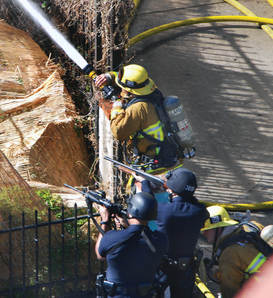 Police officers and firefighters responded to a reported shooting in Los Angeles, CA, in 2012. Any incident can present unexpected dangers.