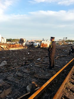 Bryan Firefighter/Paramedic Brad Moring stands guard at the plant explosion site