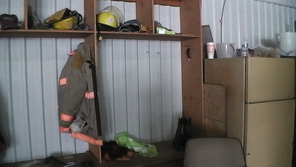 Most notable in the West fire station are the empty racks where members' gear is gone.