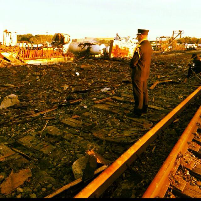 A firefighter stands guard at the scene of the West Fertilizer Plant.