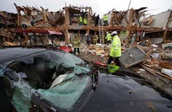 A smashed car sits in front of an apartment complex that was destroyed by the explosion in West, Texas, as firefighters conduct a search and rescue Thursday. A smashed car sits in front of an apartment complex that was destroyed by the explosion in West, Texas, as firefighters conduct a search and rescue Thursday.