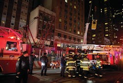 A construction transport bucket, right, is moved into place at the scene where a worker at a subway construction project was trapped underground. The worker was rescued after being trapped up to his chest in debris for several hours. One hundred fifty rescuers descended on the site to free the trapped worker. A construction transport bucket, right, is moved into place at the scene where a worker at a subway construction project was trapped underground. The worker was rescued after being trapped up to his chest in debris for several hours. One hundred fifty rescuers descended on the site to free the trapped worker.