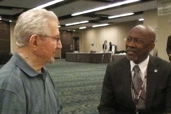 Louis Amabili (left) talks with U.S. Fire Administrator Ernie Mitchell Wednesday morning at CFSI.