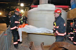 Yonkers firefighters evacuate a 'casualty' from the drill site. Yonkers firefighters evacuate a 'casualty' from the drill site.