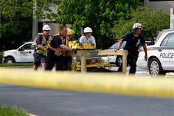 Montgomery County rescue crews move equipment toward a garage collapse. Montgomery County rescue crews move equipment toward a garage collapse.