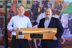 Mark Aronberg, Assistant Commissioner for FDNY Fleet Services (right), presents plaque to A. Joseph Neiner Chairman and CEO of Seagrave Fire Apparatus, LLC (left) Clintonville, Wis.