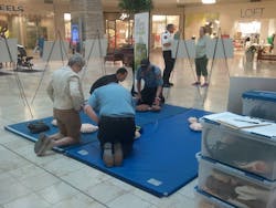 Eden Prairie, Minn., firefighters spent Saturday teaching hands-only CPR to patrons at a local mall.