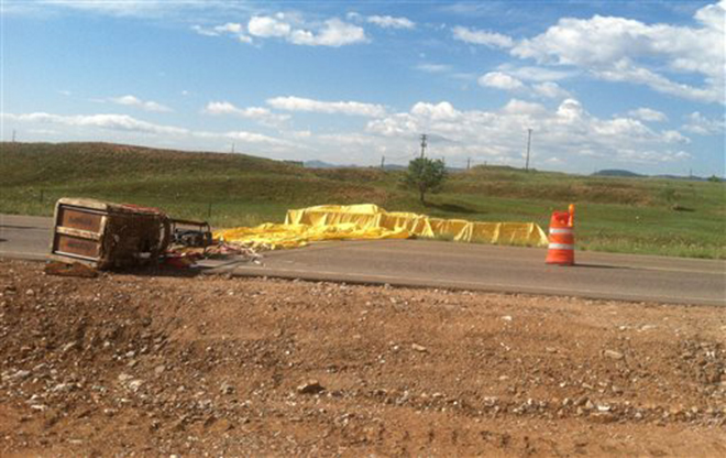 This photo provided by the Arvada Fire Department shows a hot air balloon that crashed, Saturday, June 8, 2013 in Arvada, Colo.
