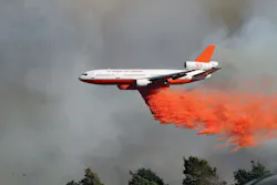 On third day of the 'Powerhouse Fire' in Los Angeles County, CA, the fire had spread to 25,000 acres. A DC-10 was called in to drop a line of retardant on the west side of the fire to prevent the fast-moving blaze from entering Kings Canyon, a densely populated and steep canyon area nearby.