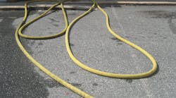 Photo 1. Stage the hose in line with your attack entrance.
