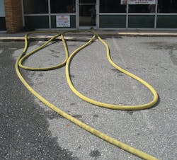 Photo 1. Stage the hose in line with your attack entrance.