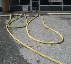 Photo 1. Stage the hose in line with your attack entrance.