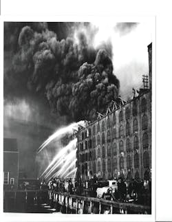 One of the most stubborn fires in FDNY history occurred on April 20, 1935, and involved a warehouse filled with crude rubber on Furman Street on the Brooklyn waterfront. Five alarms were transmitted as firemen battled the flames and smoke for more than 18 hours.