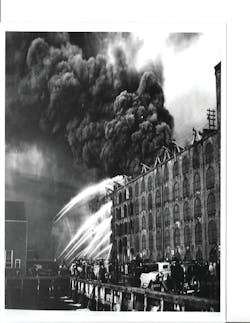 One of the most stubborn fires in FDNY history occurred on April 20, 1935, and involved a warehouse filled with crude rubber on Furman Street on the Brooklyn waterfront. Five alarms were transmitted as firemen battled the flames and smoke for more than 18 hours. One of the most stubborn fires in FDNY history occurred on April 20, 1935, and involved a warehouse filled with crude rubber on Furman Street on the Brooklyn waterfront. Five alarms were transmitted as firemen battled the flames and smoke for more than 18 hours.