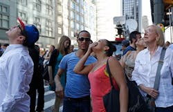 People look to the top of the 600-foot high Hearst skyscraper as two maintenance workers whose scaffolding collapsed are rescued by firefighters during the afternoon in midtown Manhattan. People look to the top of the 600-foot high Hearst skyscraper as two maintenance workers whose scaffolding collapsed are rescued by firefighters during the afternoon in midtown Manhattan.