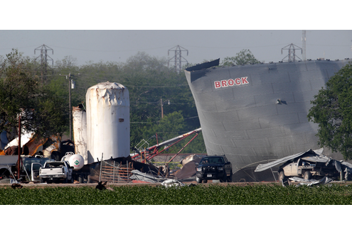 Law enforcement personnel patrol the scene Saturday, April 20, 2013, three days after an explosion at a fertilizer plant in West, Texas.