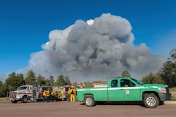 U.S. Forest Service personnel arrived to confer with Falcon Divison Chief Glenn Levy and Larkspur Chief Jamey Bumgarner as the smoke plume continues to grow to the east on the first day of the fire.