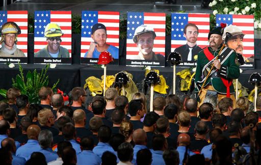 Drum Major Brian Brendel, of the Prescott Memorial Pipe and Drums, directs the group at the memorial service Tuesday.