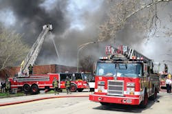Chicago, IL: April 29, 2013- - A defensive attack was made on a fully involved one-story commercial building with a bowstring truss roof. Tower Ladders 34 and 37 and Squad 5A were set up. It took about two hours to control the 3-11 alarm fire.