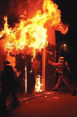 Firefighters work to open up and gain access to the structure. Firefighters work to open up and gain access to the structure.