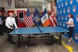 Oscar-winning actress and co-owner of SPiN New York Susan Sarandon competed against FDNY Commissioner Salvatore J. Cassano at the quarters of Engine 14 in Manhattan on August 21, 2013. SPiN New York and STIGA will donate 10 table tennis tables to FDNY firehouses and EMS stations throughout New York City.