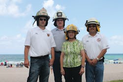Carol Landau with (from left) Chiefs Dent, Altman and Truman Carol Landau with (from left) Chiefs Dent, Altman and Truman