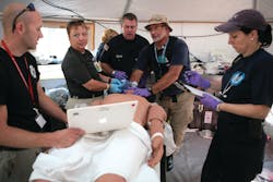 DMAT members treat the symptoms shown by a patient simulator while training at FEMA&rsquo;s Center for Domestic Preparedness.