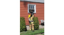 Woodbridge Firefighter Ryan Horvath hands his self-contained breathing apparatus (SCBA) out a bedroom rear window to a second firefighter before diving head-first out the window and falling to the ground. He was first to escape the fire after two firefighters become disoriented and issued a &apos;Mayday.&apos;