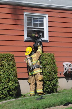 Woodbridge Firefighter Ryan Horvath hands his self-contained breathing apparatus (SCBA) out a bedroom rear window to a second firefighter before diving head-first out the window and falling to the ground. He was first to escape the fire after two firefighters become disoriented and issued a 'Mayday.' Woodbridge Firefighter Ryan Horvath hands his self-contained breathing apparatus (SCBA) out a bedroom rear window to a second firefighter before diving head-first out the window and falling to the ground. He was first to escape the fire after two firefighters become disoriented and issued a 'Mayday.'