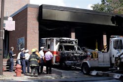 The burnt hulk of a medic unit is towed from the the Engine 8, Ladder 2 firehouse Friday, Sept. 27, 2013, in the Old City neighborhood of Philadelphia. The burnt hulk of a medic unit is towed from the the Engine 8, Ladder 2 firehouse Friday, Sept. 27, 2013, in the Old City neighborhood of Philadelphia.