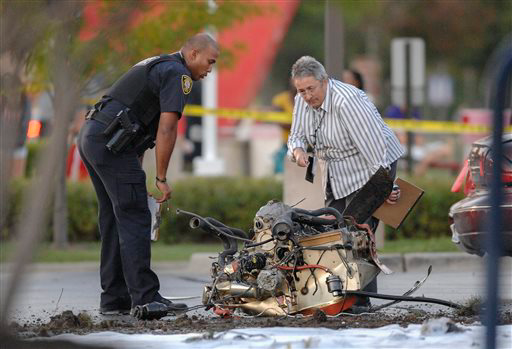 Investigators check out plane crash debris.