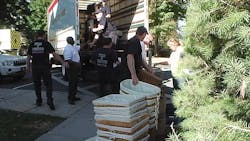 Recruits from Anne Arundel County and Howard County fire personnel load office supplies onto a truck. Recruits from Anne Arundel County and Howard County fire personnel load office supplies onto a truck.