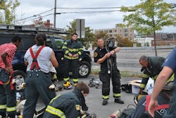 High school students learn to properly don personal protective equipment (PPE) during an 'Introduction to Firefighting Fundamentals' course in cooperation with the Portland, ME, Fire Department. Engaging the community can be accomplished in many ways to help fire demonstrate the value of their services. High school students learn to properly don personal protective equipment (PPE) during an 'Introduction to Firefighting Fundamentals' course in cooperation with the Portland, ME, Fire Department. Engaging the community can be accomplished in many ways to help fire demonstrate the value of their services.