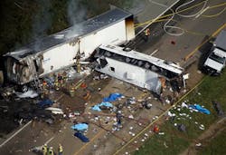 In this aerial photo, emergency workers respond to a crash involving a passenger bus and a tractor-trailer near Dandridge, Tenn., on Wednesday, Oct. 2, 2013 In this aerial photo, emergency workers respond to a crash involving a passenger bus and a tractor-trailer near Dandridge, Tenn., on Wednesday, Oct. 2, 2013