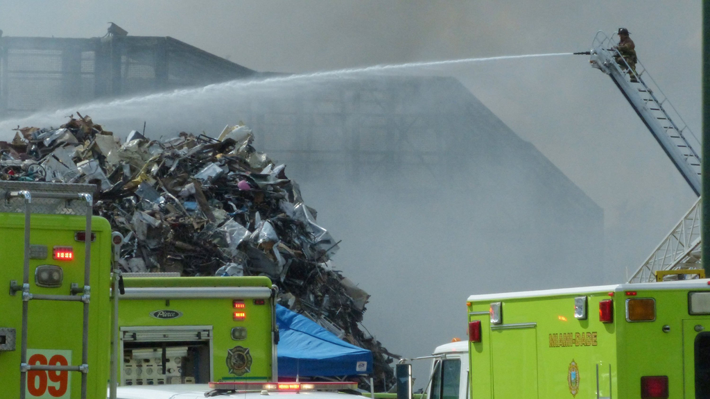 Hundreds of vehicles and tires burned at a scrapyard in Opa Locka on Monday.