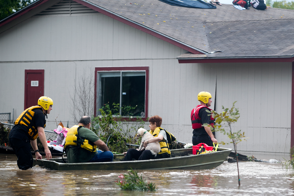 Swift water techs take residents to safety.