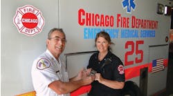 Chicago Fire Department Deputy District Chief Robert Anthony presents Paramedic Anne Gradolf with a dedicated meter for detecting carbon monoxide (CO) gas. Last year, Gradolf&apos;s &apos;gut instincts&apos; saved the lives of 10 people suffering from CO poisoning in a home in city&apos;s southeast side.