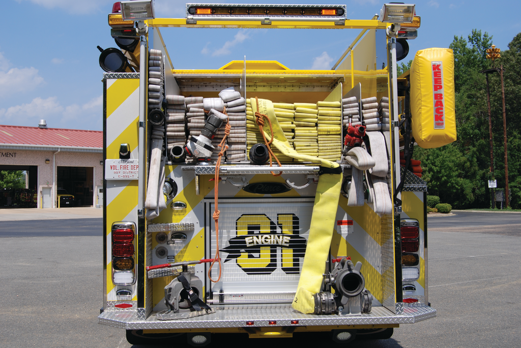 Bay District, MD, Fire Department Engine 91 carries 1,000 feet of three-inch hose and 1,000 feet of four-inch supply line together with a three-inch leader line and two attack lines with a 750-gallon, L-shaped water tank. Note the rope lines attached to the supply line beds so that personnel do not have to climb onto the rear step.