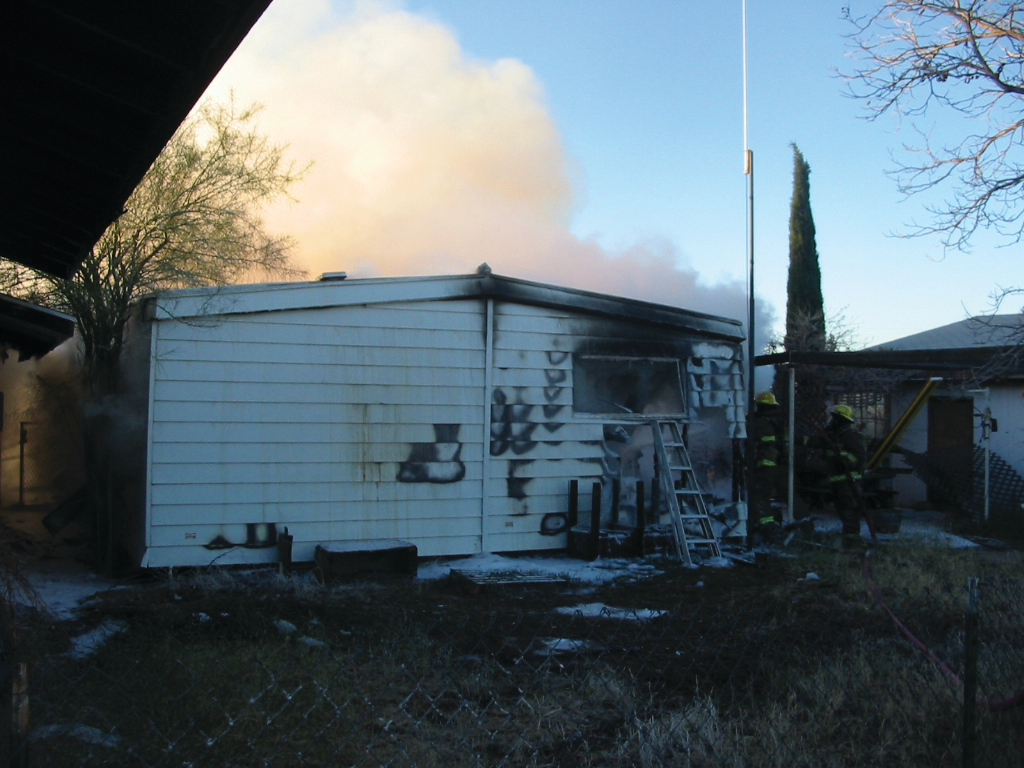 The 92-year-old woman was rescued out of this window in the rear of the burning home.
