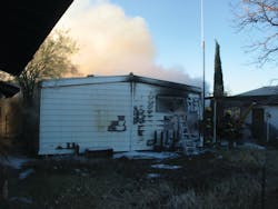 The 92-year-old woman was rescued out of this window in the rear of the burning home. The 92-year-old woman was rescued out of this window in the rear of the burning home.