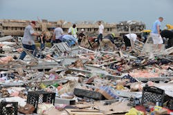 Emergency responders and civilians quickly came face to face with the total destruction created by the Moore tornado.