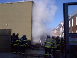 Baltimore crews battling flames, cold Tuesday afternoon.