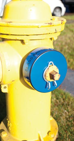 Figure 1. Color-coded discharge cap covers provide an easy and highly visible way to identify the gpm rating of hydrants. Figure 1. Color-coded discharge cap covers provide an easy and highly visible way to identify the gpm rating of hydrants.