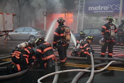 The afternoon fire destroyed the building of origin, a dollar store. Companies prevented the fire from spreading to a five-story apartment building next door.