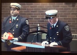 Penfield Fire Chief Christopher Ebmyer honors Tyler at his funeral.