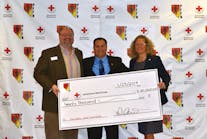 Scott Gorgon (c.), Secretary Treasurer of the PFFN, presents their donation check to the American Red Cross.
